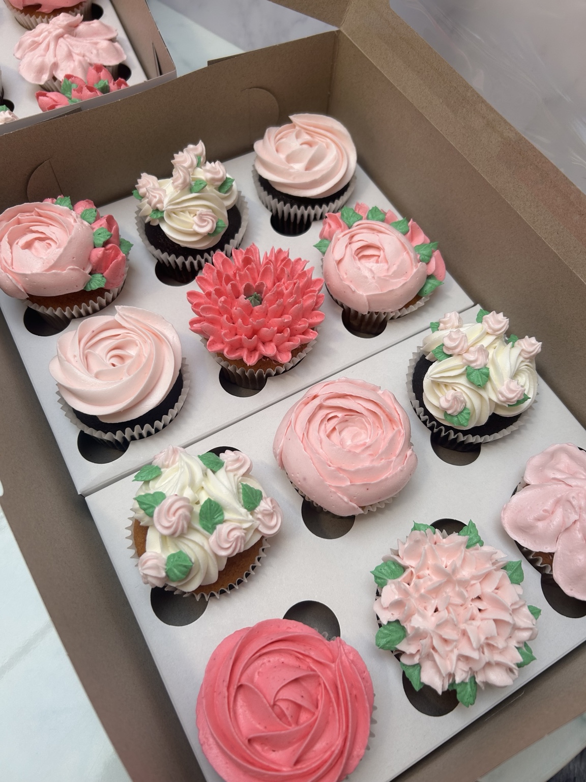 Pink floral buttercream cupcake selection