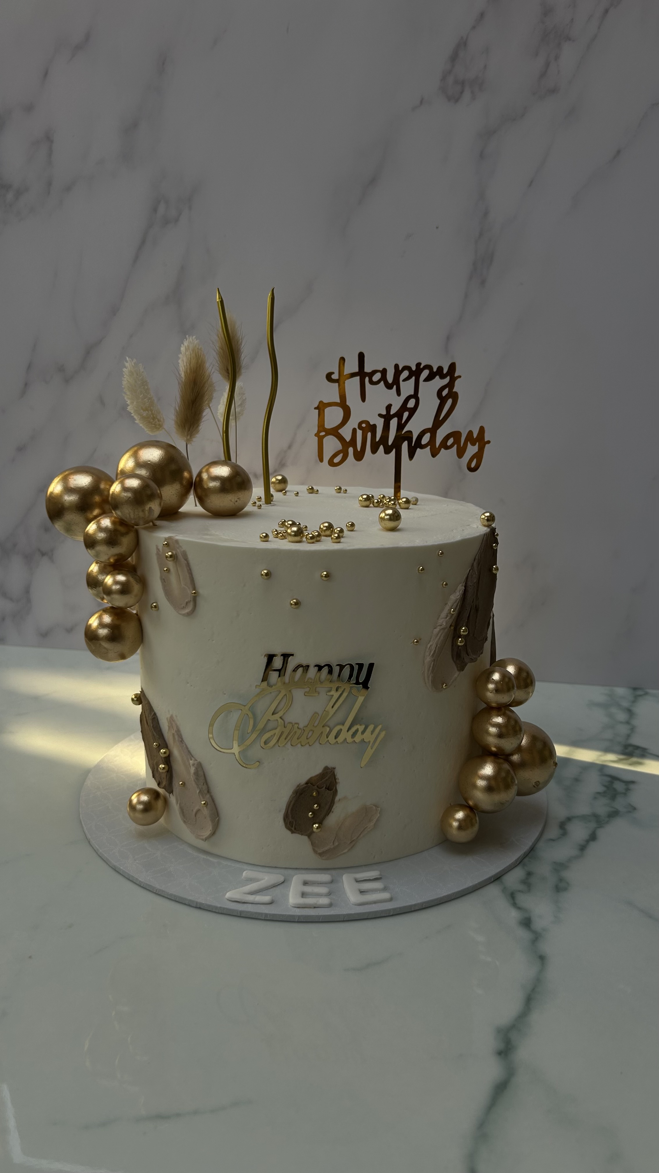 Happy Birthday ZEE cake with gold balls and gold accents