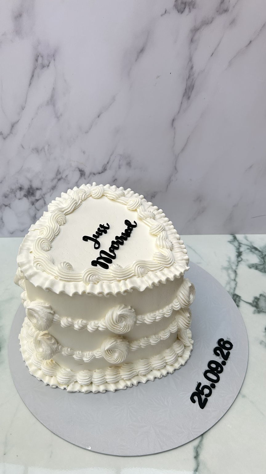 White heart-shaped Just Married wedding cake